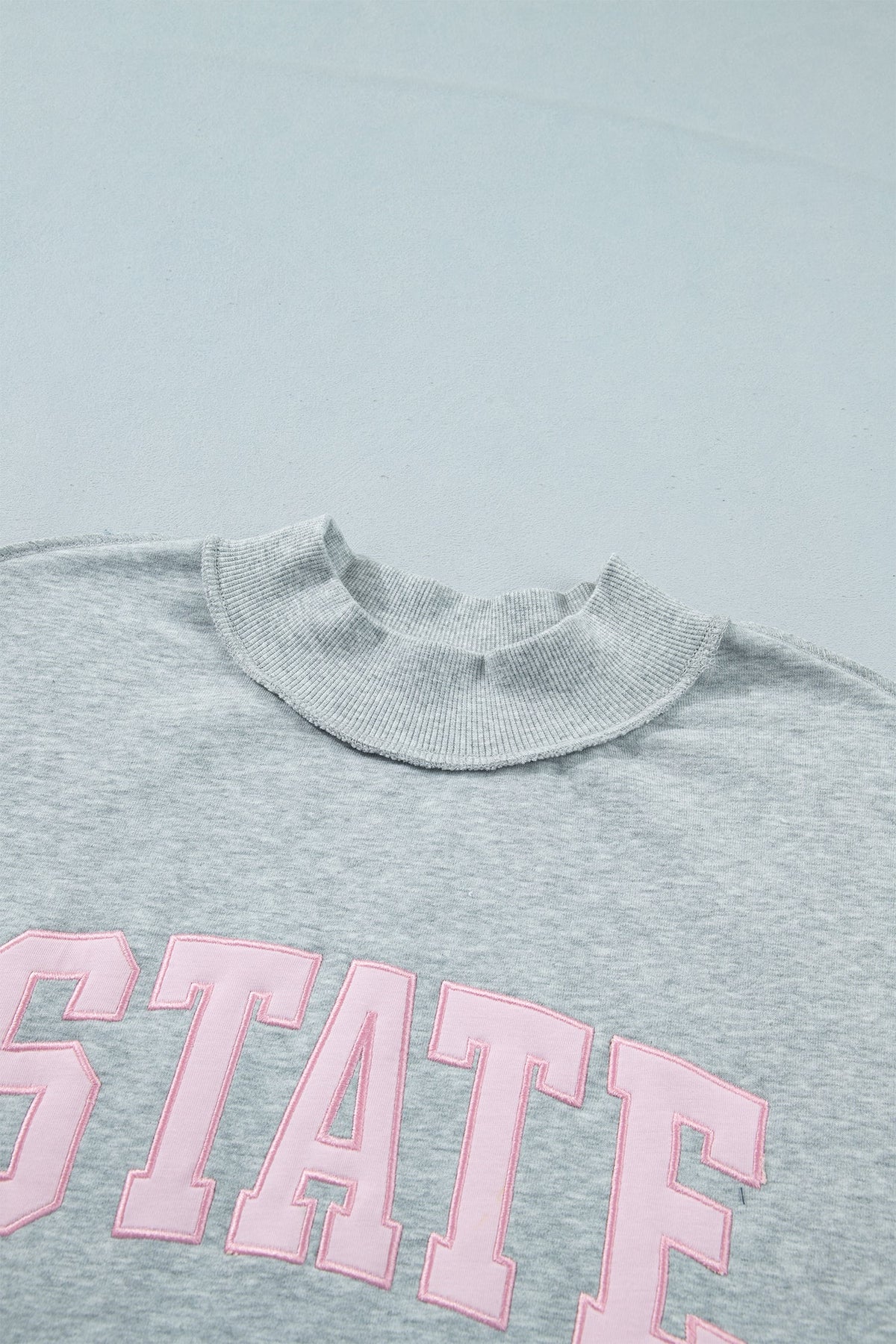 STATE Embroidered Exposed Seam Mock Neck Sweatshirt