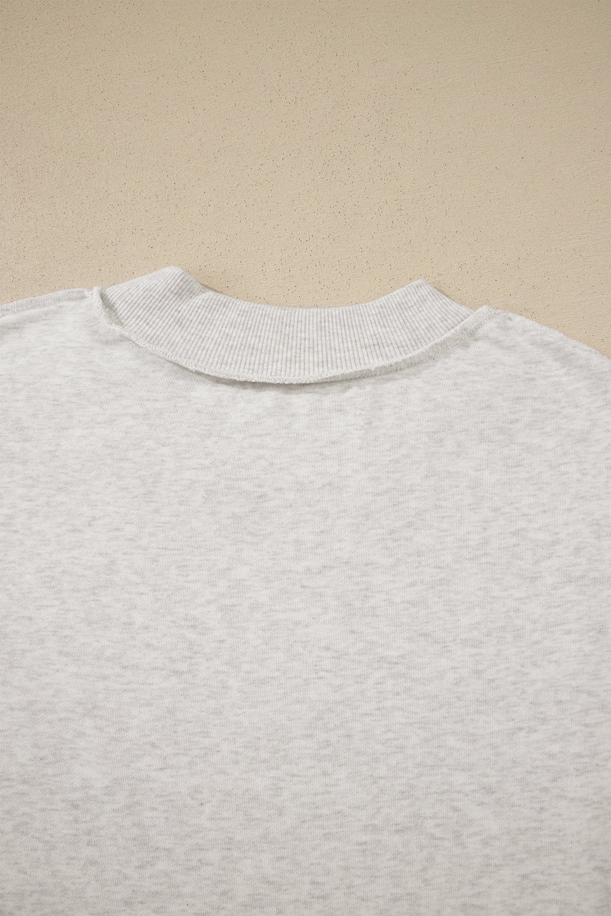 Solid Exposed Seam Mock Neck Tee